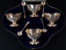 Silver: a cased set of four pedestal salts by Zachariah Barraclough & Sons, Chester 1914, with c