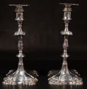 The Denis Lacy Hulbert Collection: a pair of George II cast silver candlesticks by William Cafe, Lon