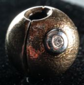 Jewellery: Ole Lynggaard- a yellow and white metal clasp, marked Ole L 585 and testing as 14ct gold,
