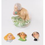 Ceramics: an Aladdin Art Deco powder pot lid in the form of a young maiden holding a bouquet, 12.5cm