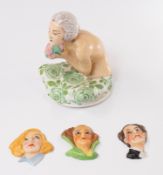 Ceramics: an Aladdin Art Deco powder pot lid in the form of a young maiden holding a bouquet, 12.5cm