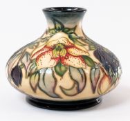 Ceramics: a squat bulbous Moorcroft vase in the Christmas Hellebore pattern, dated '99' to the under
