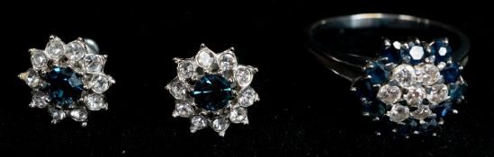 Jewellery: a white metal ring, marked 750 and testing as 18ct gold, cluster set with diamonds within