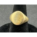 Jewellery: a 9ct yellow gold signet ring, the table bearing the remnants of the original inscription