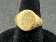 Jewellery: a 9ct yellow gold signet ring, the table bearing the remnants of the original inscription