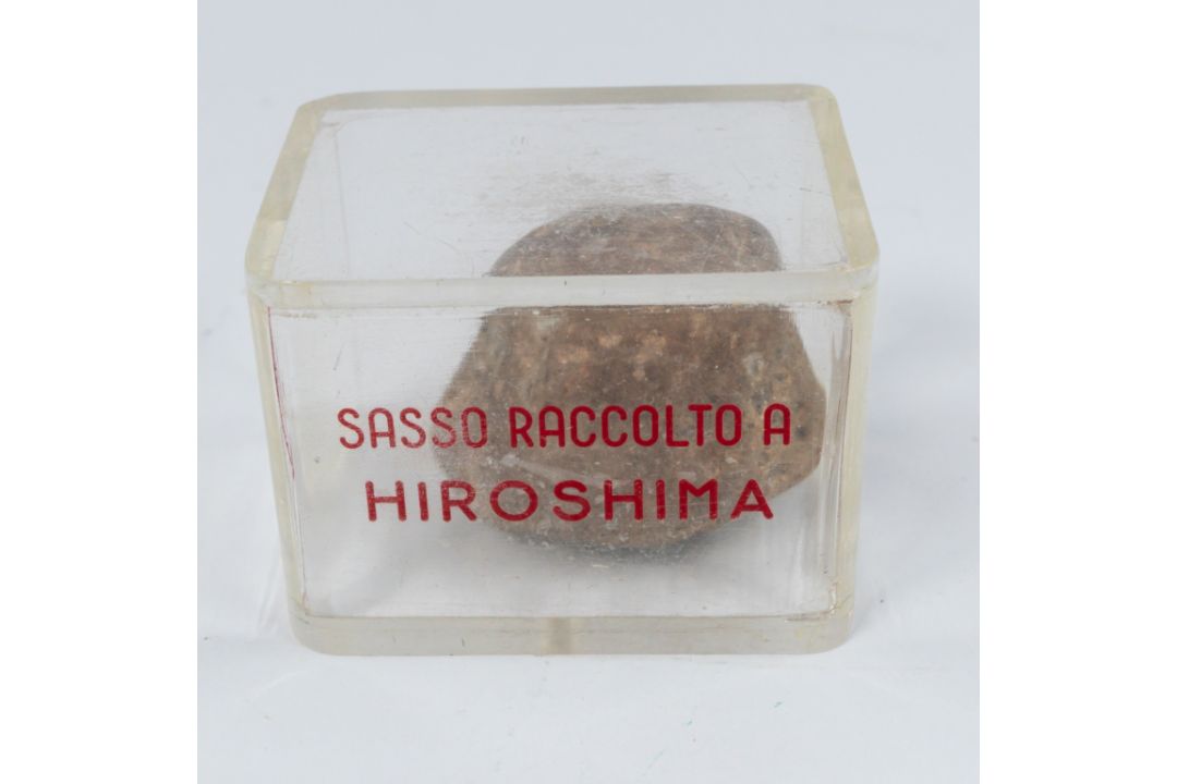 Social History: an Italian perspex cased stone sample from Hiroshima, taken after the 1945 atomic bo - Image 1 of 2