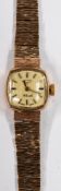 Watches: a ladies 9ct gold cushion cased wristwatch by Rotary, on integral bark effect tapering stra