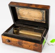 Decorative Arts: a late 19th century miniature Swiss music box in inlaid case, playing four airs, 12