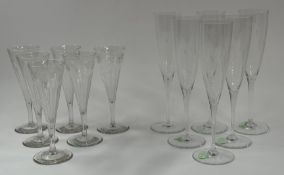 Glassware: A set of six Baccarat glass champagne flutes, 20th century, with rounded bowls raised on 