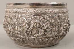 Silver: a Burmese white metal bowl, unmarked but testing as silver, decorated in high relief with a 