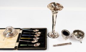 Silver: a cased set of six enamelled coffee spoons by Mappin & Webb; a spill vase, loaded base; 