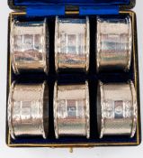 Silver: a boxed set of six numbered napkin rings by Charles Horner, Birmingham 1905,each with engine