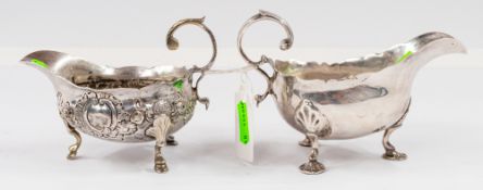 Silver: a Victorian silver sauce boat, London 1873, standing upon three shell feet, together with a 