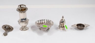 Silver: a shell butter dish, Birmingham hallmarked, a sugar caster, a tea strainer and a plated tea 