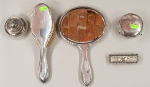 Silver: a hand mirror, a matching hairbrush, a toothpick box, and two dressing table boxes, various 