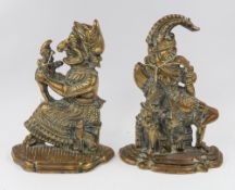 Metalware: a pair of brass Punch and Judy door stops, flat-backed and modelled in traditional pose o