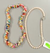 Costume Jewellery: a cultured pearl necklace with silver clasp, 41cm, together with a dyed shell nec