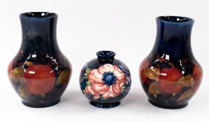Ceramics: William Moorcroft (1872-1945) for Moorcroft Pottery, a near pair of vases in the Pomegrana