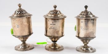 Silver: three matched pedestal pots, a pair marked for London 1843, the third with an earlier, parti