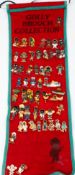Collectables: A collection of 54 'Golly' brooches, 20th century, mounted on a felt hanging.