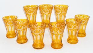 Glass: Nine Bohemian glass beakers or tumblers, late 19th/20th century, flashed in amber and engrave