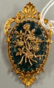 Jewellery: an oval moss agate brooch in ornate 9ct yellow gold frame, London 1970, with applied flor