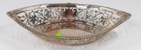 Silver: a bread basket of navette form, probably William Neal, Chester 1902, with leaf and vine pier