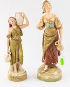 Ceramics: a Royal Dux figurine of a water carrier, with muted green robe and naturalistic base, 24cm