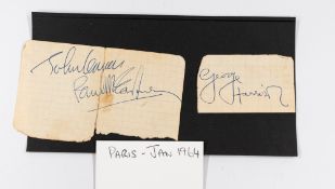 Autographs: The Beatles; George Harrison, John Lennon and Paul McCartney on exercise book part pages