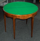 Furniture: a late George III mahogany folding demilune games table with satinwood stringing, replace