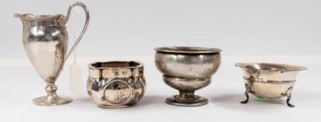 Silver: a cream jug of helmet form, Birmingham 1938; a sugar bowl upon three feet, another pedestal 
