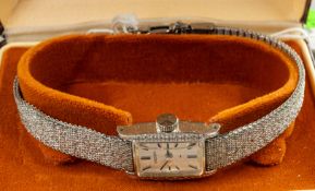 Watches: a ladies mechanical wristwatch by Seiko, with integral mesh strap, c.17.5cm long, with orig