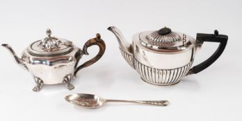 Silver: A silver teapot, Birmingham 1903, of lobed form, raised on four paw feet, with a wooden hand
