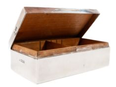 Silver: A silver cigarette box, London 1899, the rectangular form with a wood lining, with faint mon