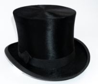 Vintage fashion: A black silk plush top hat, with wide brown leather sweat band, interior mark 'Spec
