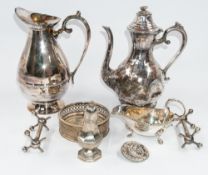 Metalware: a Britannia metal coffee pot, a large jug, an EPNS sauceboat, a pair of knife rests, a wi