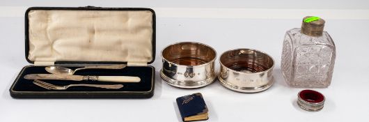Silver: a pair of millennium hallmarked bottle coasters with treen bases, 9cm internal diameter, eac