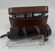 A leather-cased glass riding spirit flask, with plated metal mount, and a leather-cased plated gentl