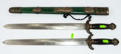 Militaria: a pair of Chinese swords, Shuāngjiàn, each with horn handles and brass fitments, the guar