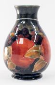 Ceramics: a Moorcroft baluster vase in the pomegranate pattern, 12cm. All over light crazing, a numb
