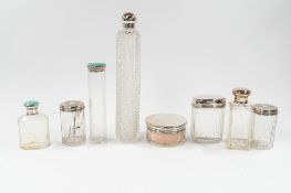 Silver: eight silver-mounted glass dressing table bottles or jars, a pair with engraved tops, London