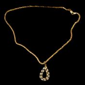 Jewellery: an 18ct yellow gold Franco style gold chain with unmarked yellow metal teardrop pendant s