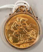 Coins: a 1927 George V gold full sovereign in pendant mount, gross weight 9.4g.