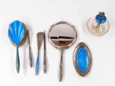 Silver: A silver and enamel ladies dressing table set, Birmingham 1928/9, decorated with blue guillo