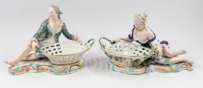 Ceramics: a matched pair of Meissen sweetmeat figures, 19th century, each modelled with a reclining 