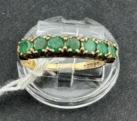 Jewellery: 9ct gold half hoop ring set with seven round emeralds, est. weight of (7) 0.70ct, hallmar