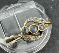Jewellery: 18ct gold nine-stone crossover cluster ring, with three graduated sapphires at the centre