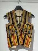 Vintage fashion: a Turkish embroidered waistcoat, with wool needlework and brocade panels on a silk 