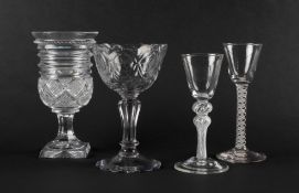 Two wine glasses, c.1760, with round funnel bowls, one raised on a double-knopped airtwist stem, the