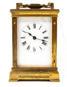 Clocks: a small brass-cased carriage timepiece, late 19th century, of architectural form with glass 